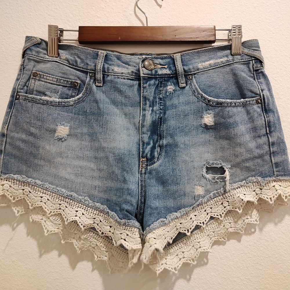 Jean shorts with lace by Free People. Size 28